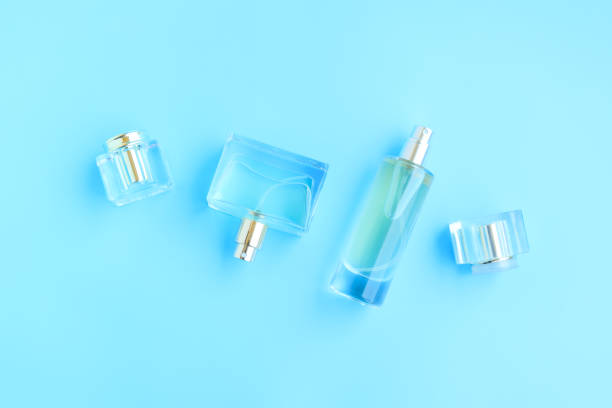 istock Perfume bottle on blue background, Glass bottle of perfumery 2153000658