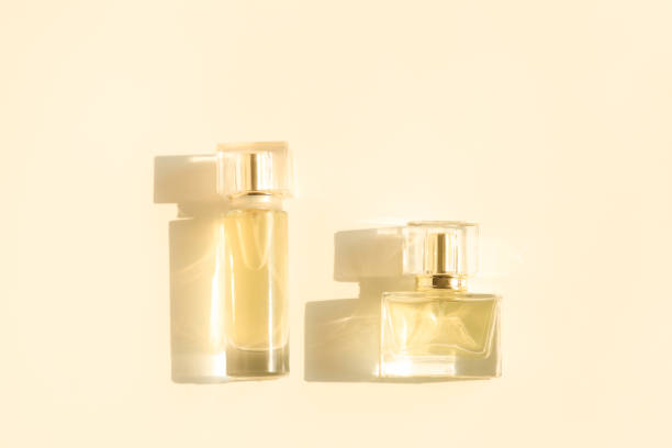 istock Perfume bottle on beige background, Glass bottle of perfumery 2153000660