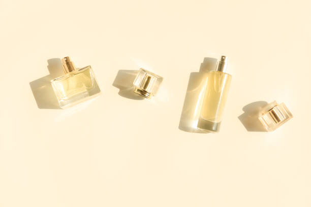 istock Perfume bottle on beige background, Glass bottle of perfumery 2153000665