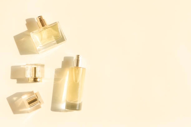 istock Perfume bottle on beige background, Glass bottle of perfumery 2153000666