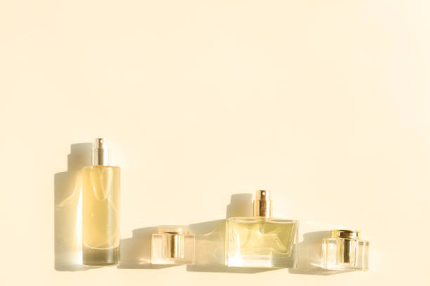 istock Perfume bottle on beige background, Glass bottle of perfumery 2153000670