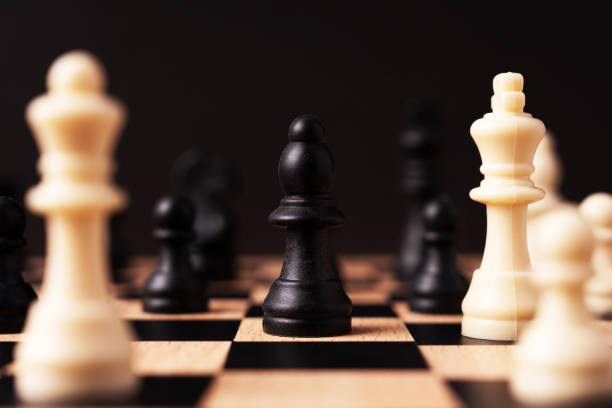 Black bishop chess surround by other chess