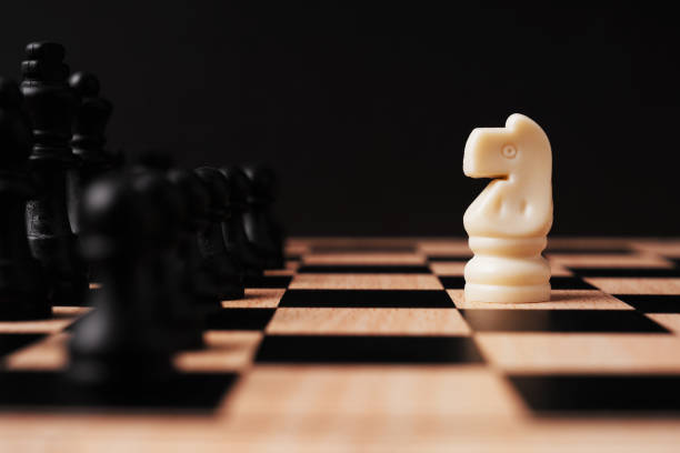 Chess pieces two officers black and white on a white background.