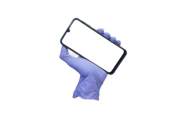istock Glove holding smartphone with white screen display.  isolated white background 2153002436