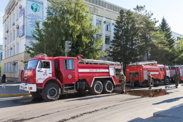 Uralsk, Oral, Kazakhstan (Qazaqstan), 13.06.2018: Firefighters deploy a fire hose. The fire crew arrived to extinguish the fire in the building.