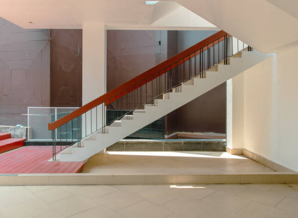 Going upstairs and down stairs with wooden railing and window. Interior structure design concept