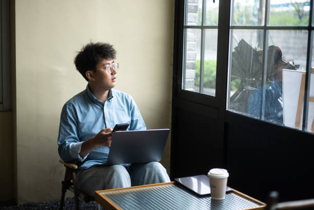 istock businessman working in room 2153006149
