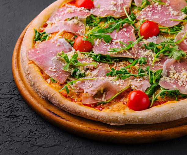istock Gourmet italian pizza with prosciutto and arugula 2153006215