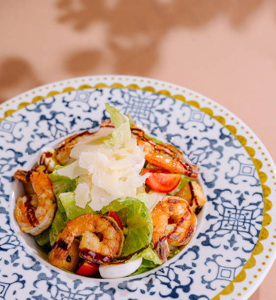 istock Gourmet grilled shrimp caesar salad on decorative plate 2153006282