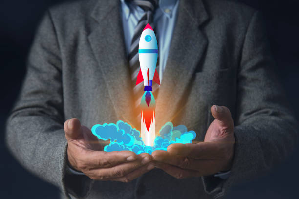 istock Businessman hands holding rocket icon, Rocketing take off with a targeted launch speed, Wealth fast 2153006515