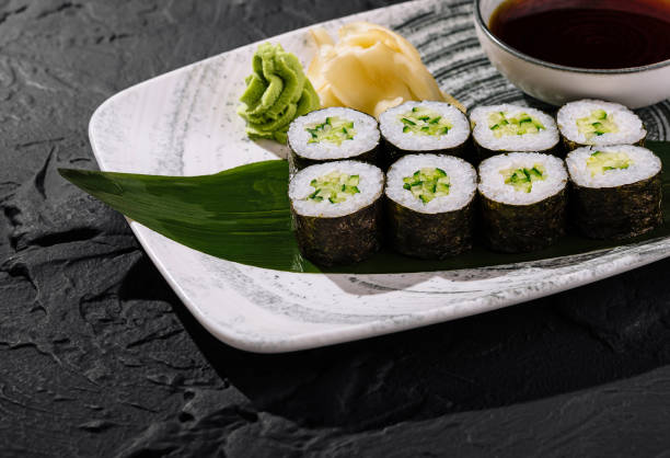istock Fresh avocado sushi roll on slate background 2153006700