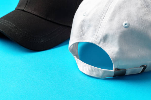 istock Baseball caps on blue background studio shot 2153007162