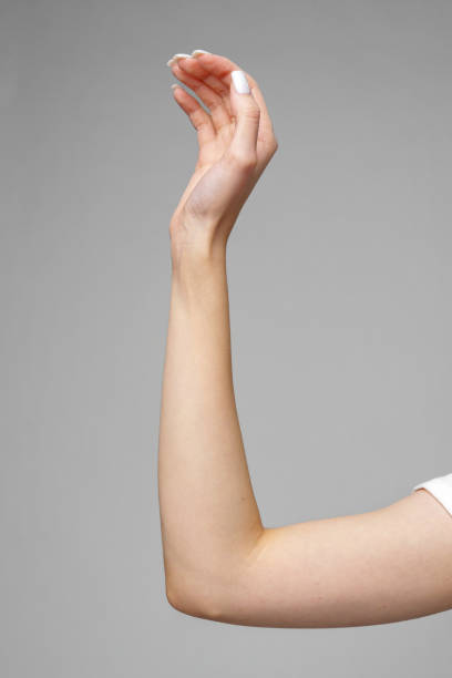 istock Female hand gesturing sign against gray background 2153007172