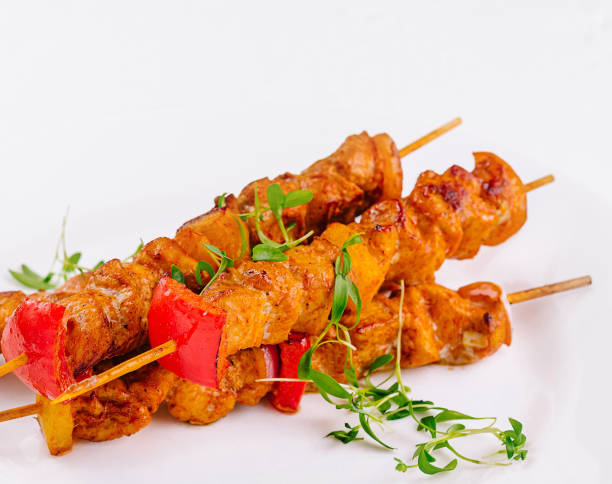 istock Juicy grilled chicken skewers on white plate 2153007310