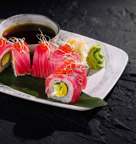 istock Exquisite tuna sushi roll on dark slate background 2153007401
