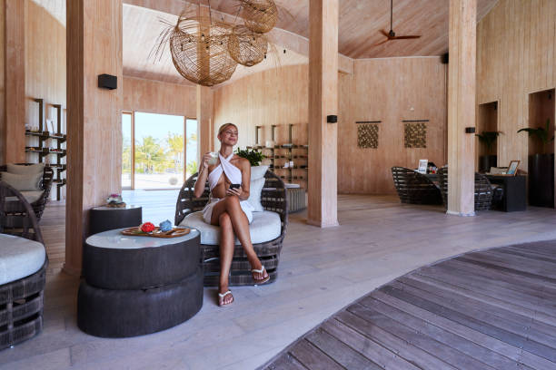istock Smiling woman using mobile phone at the spa. 2153009181