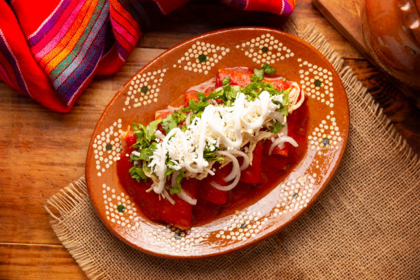 istock Mexican Food Tomato sauce Enchiladas topview 2153009707