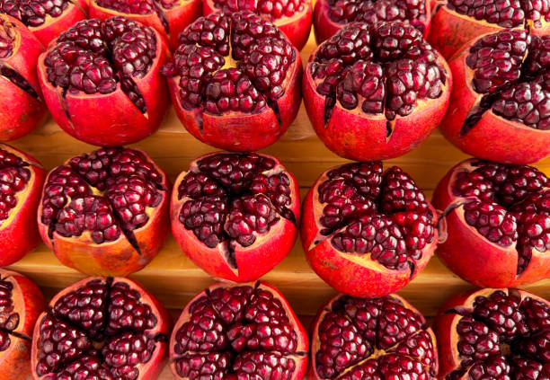 The first juicy pomegranate as a background.