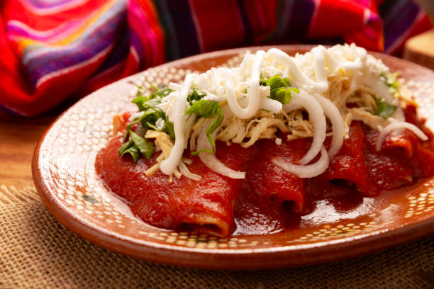 istock Mexican Food Tomato sauce Enchiladas closeup 2153009714
