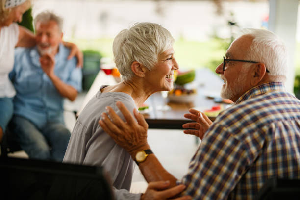 istock Happy mature couple talking during social gathering on a patio. 2153010149