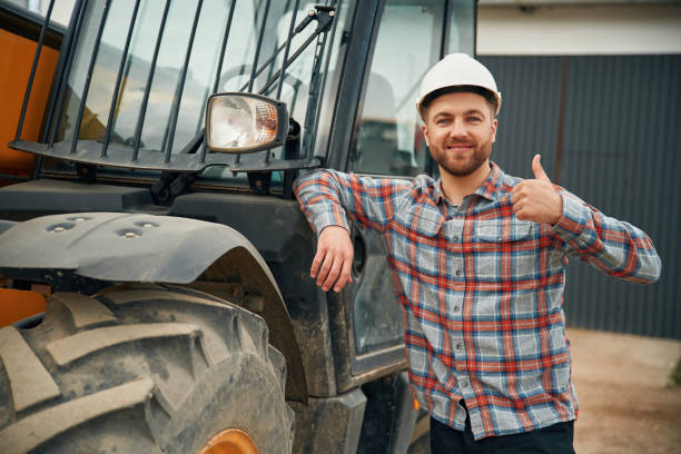istock Leaning on the vehicle. Man is with tractor. Agricultural worker 2153010796