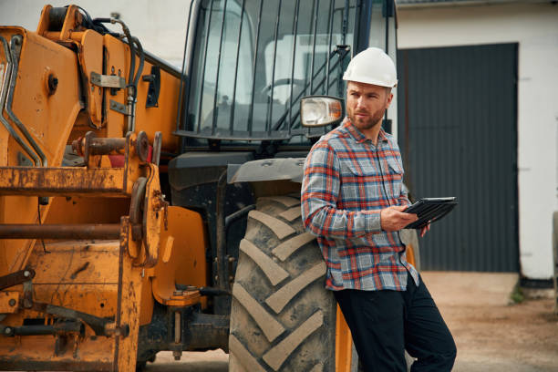 istock Digital tablet in hands. Man is with tractor. Agricultural worker 2153010919