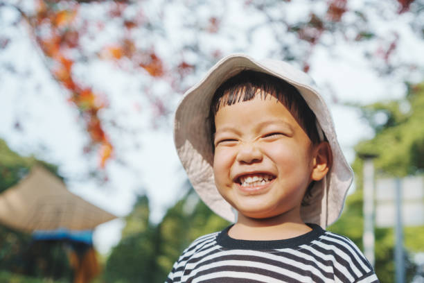 istock Asian child boy laughing outdoor. 2153011670