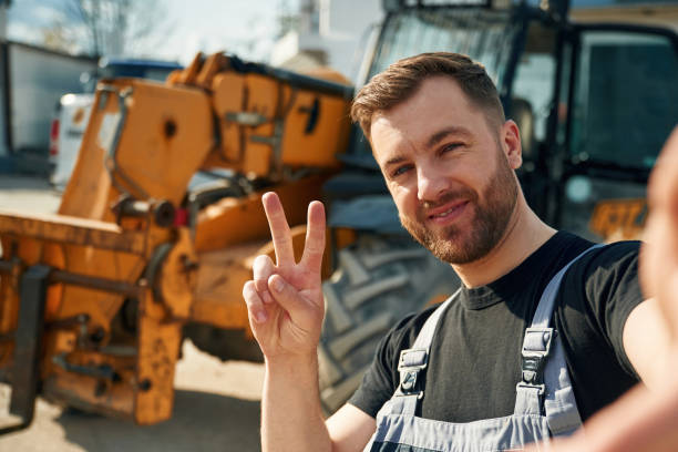 istock Making selfie, smiling. Man is with tractor. Agricultural worker 2153012588