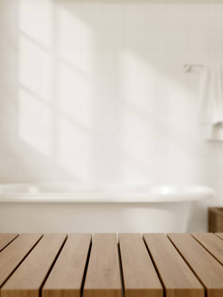 istock A space for showcasing products on a wooden table in a modern white bathroom featuring a bathtub. 2153012602