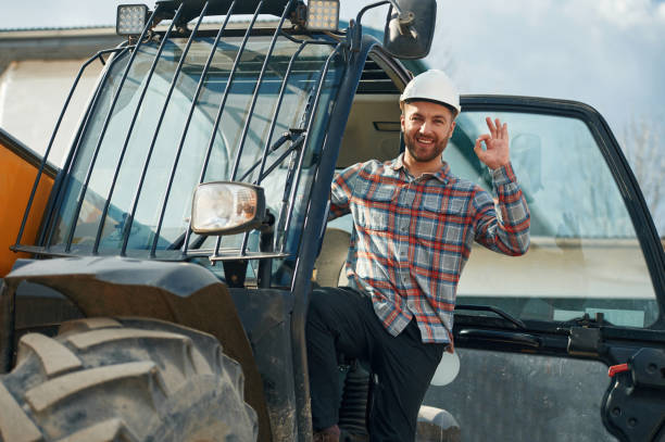 istock Happy driver. Man is with tractor. Agricultural worker 2153013274