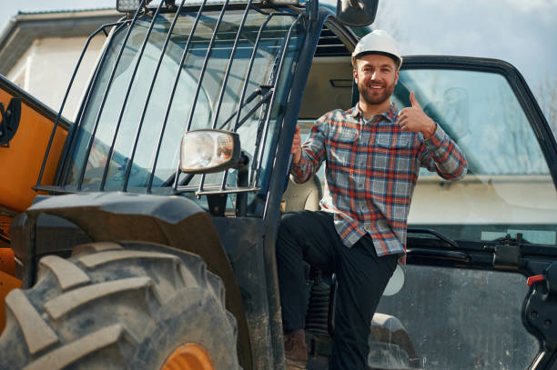 istock Happy driver. Man is with tractor. Agricultural worker 2153013284
