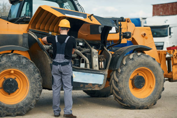 istock Doing maintenance. Man is with tractor. Agricultural worker 2153014047
