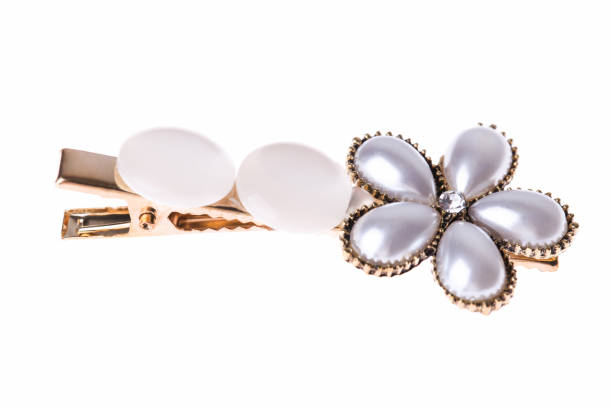 Hair clip with flower made of decorative pearls isolated on white background