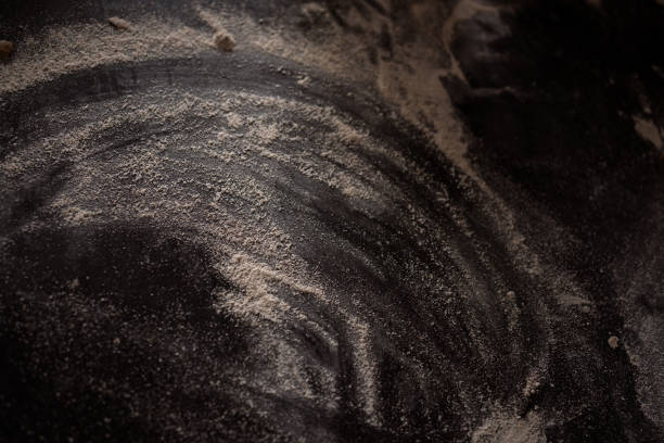istock light flour on a dark table abstract picture 2153014569