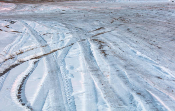 istock Frozen dirt road in nature 2153014938