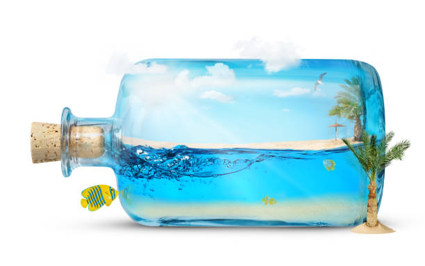 Underwater world and a coastline in the bottle isolated on white background. Summer travel and vacations concept.