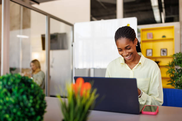 istock Young woman teleconferencing on laptop while working from modern office 2153015753