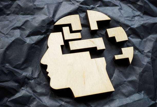istock The head falls apart into puzzle pieces. Mental illness or memory problems. 2153016175