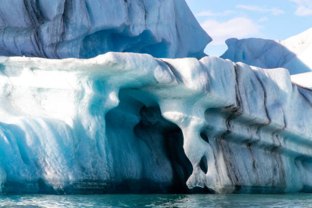 istock A large ice block with a blue hole in it 2153018481