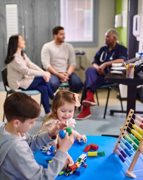 istock parents chatting to doctor on children's ward 2153020140