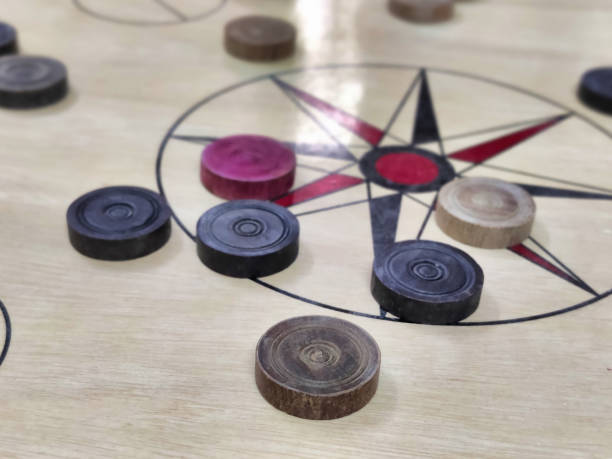 istock Carrom coins on a carrom board shot during daylight 2153020410