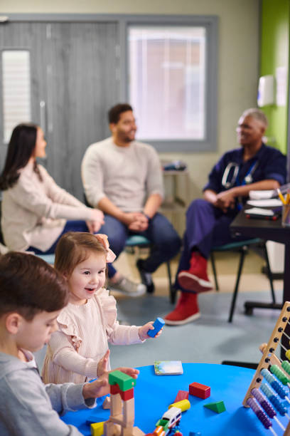 istock parents chatting to doctor on children's ward 2153020465