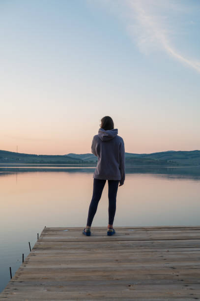 istock Woman on the pier 2153022045