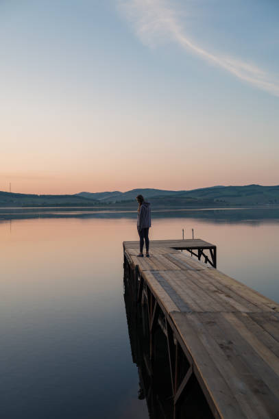 istock Woman on the pier 2153022095