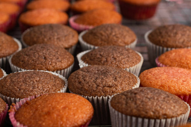 istock Freshly baked cupcakes on pastry table. 2153022900