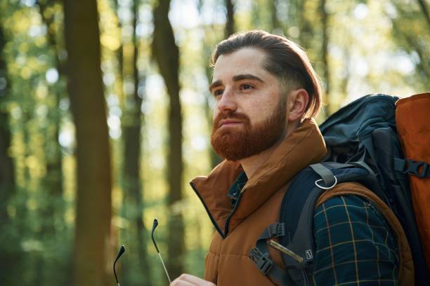 istock Bearded man is in the forest at daytime 2153022917