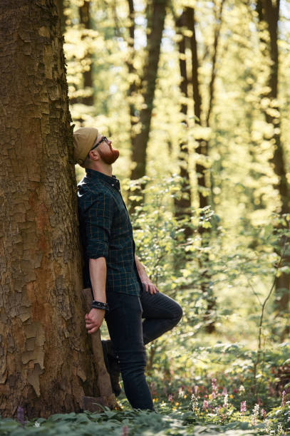 istock Bearded man is in the forest at daytime 2153023190