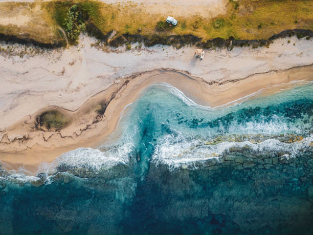 istock Aerial view of a boat stranded on a beach 2153024836