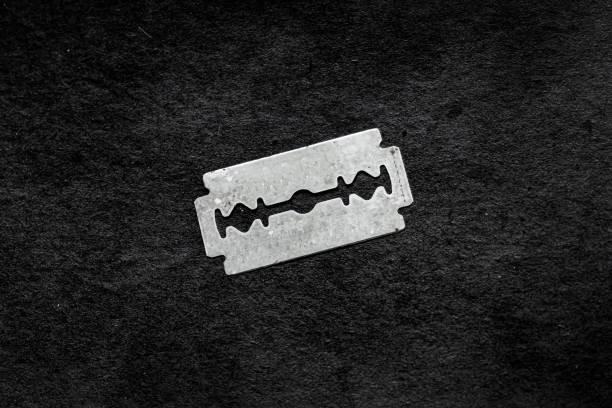 istock Close up of a sharp razor against a black background 2153026531