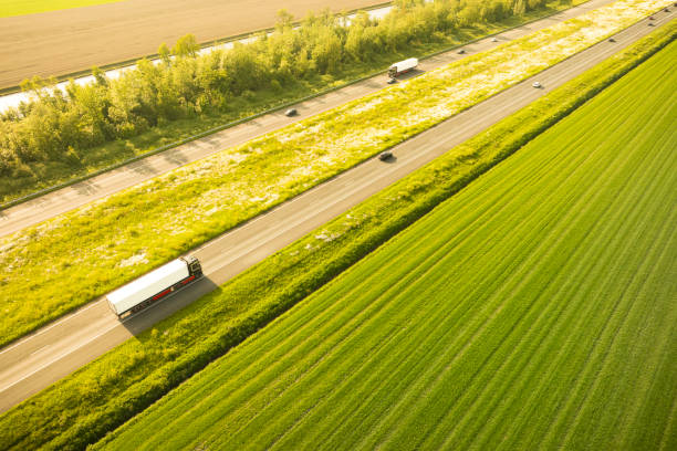 Traffic on the A6 highway in Flevoland Netherlands during springtime sunset